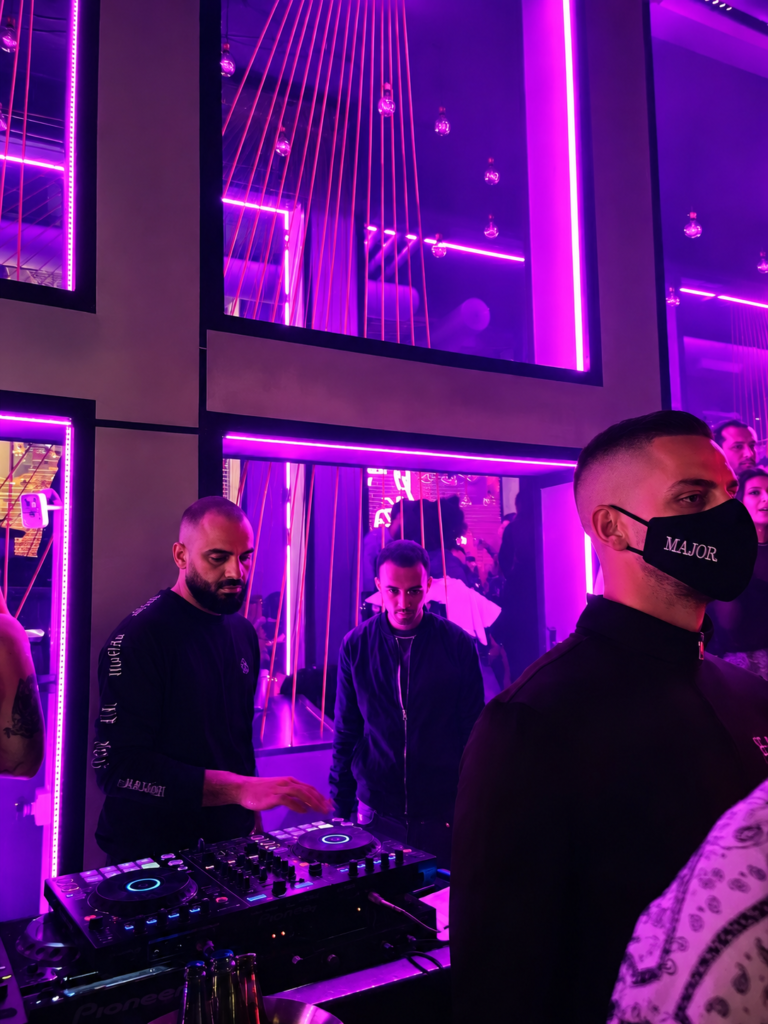 SIRA-licensed nightclub security officer checking ID at Dubai venue entrance