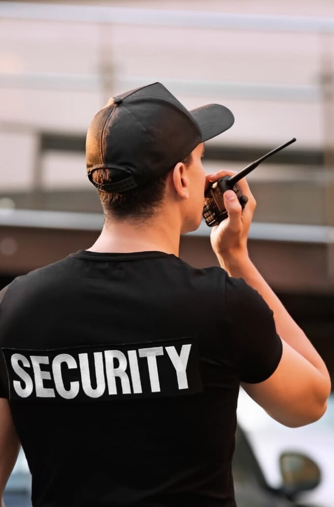 Licensed security guard patrolling luxury villa entrance in Palm Jumeirah Dubai